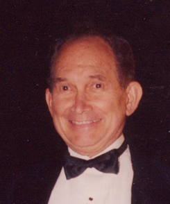 Merlin in tux singing